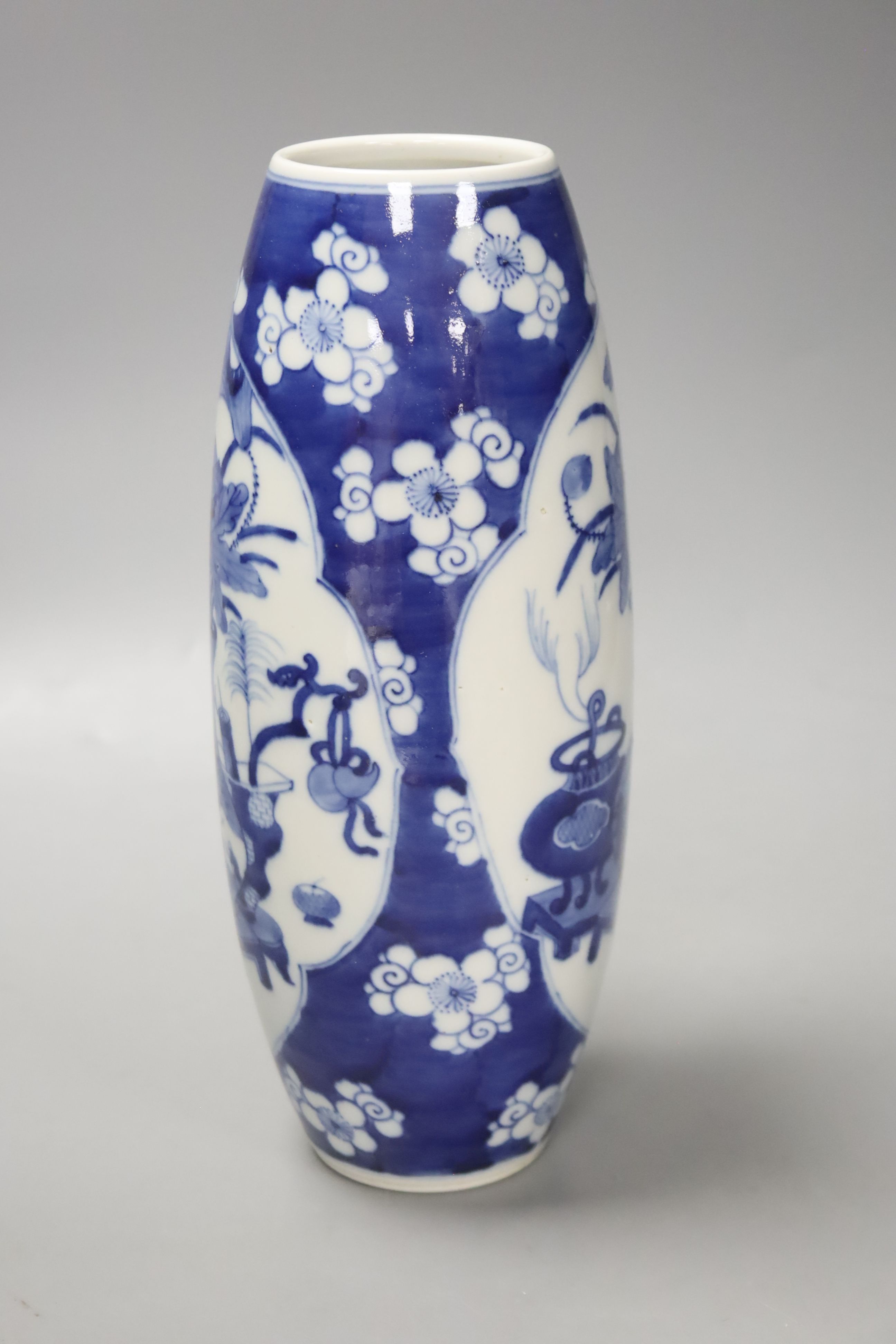 A Chinese blue and white antiques elongated oviform vase, c.1900, height 26cm